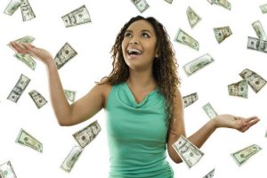 woman standing with open arms amidst falling money